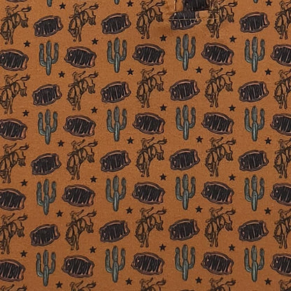 Pattern of cowboys, cacti, and steaks on a brown background