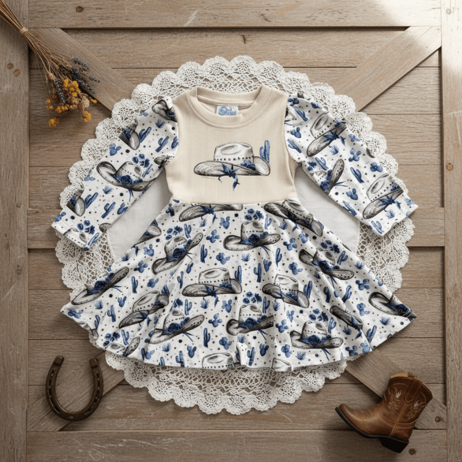 Children's outfit with cowboy design on a wooden surface
