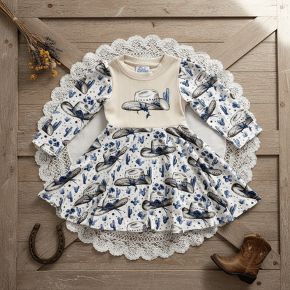 Children's outfit with cowboy design on a wooden surface