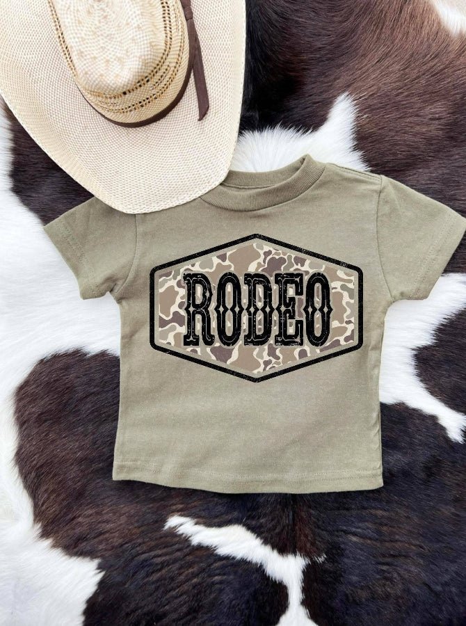 Children's t-shirt with 'RODEO' print on a cowhide rug