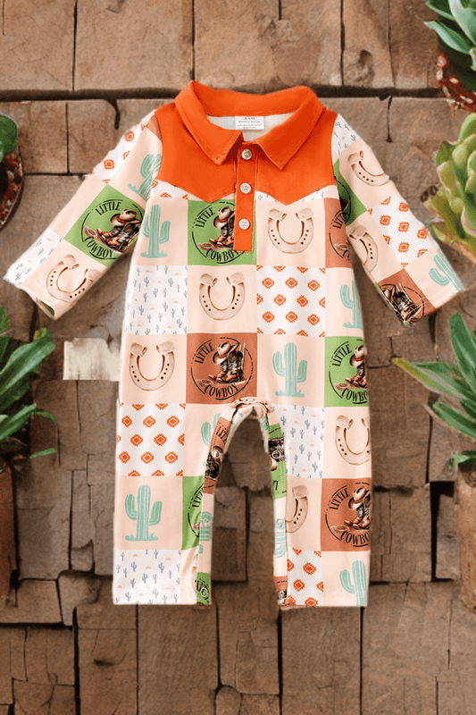 Children's outfit with cowboy-themed pattern on a wooden background