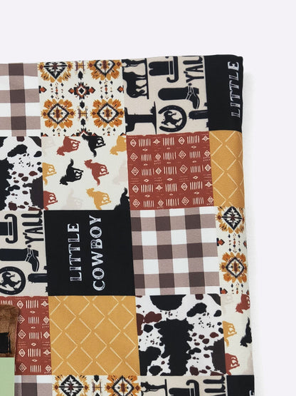 Patchwork blanket with cowboy-themed patterns and text on a white background