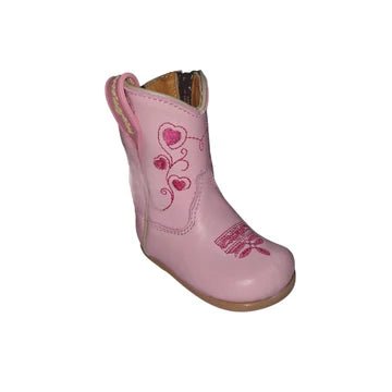 Pink children's cowboy boot with heart designs on a white background