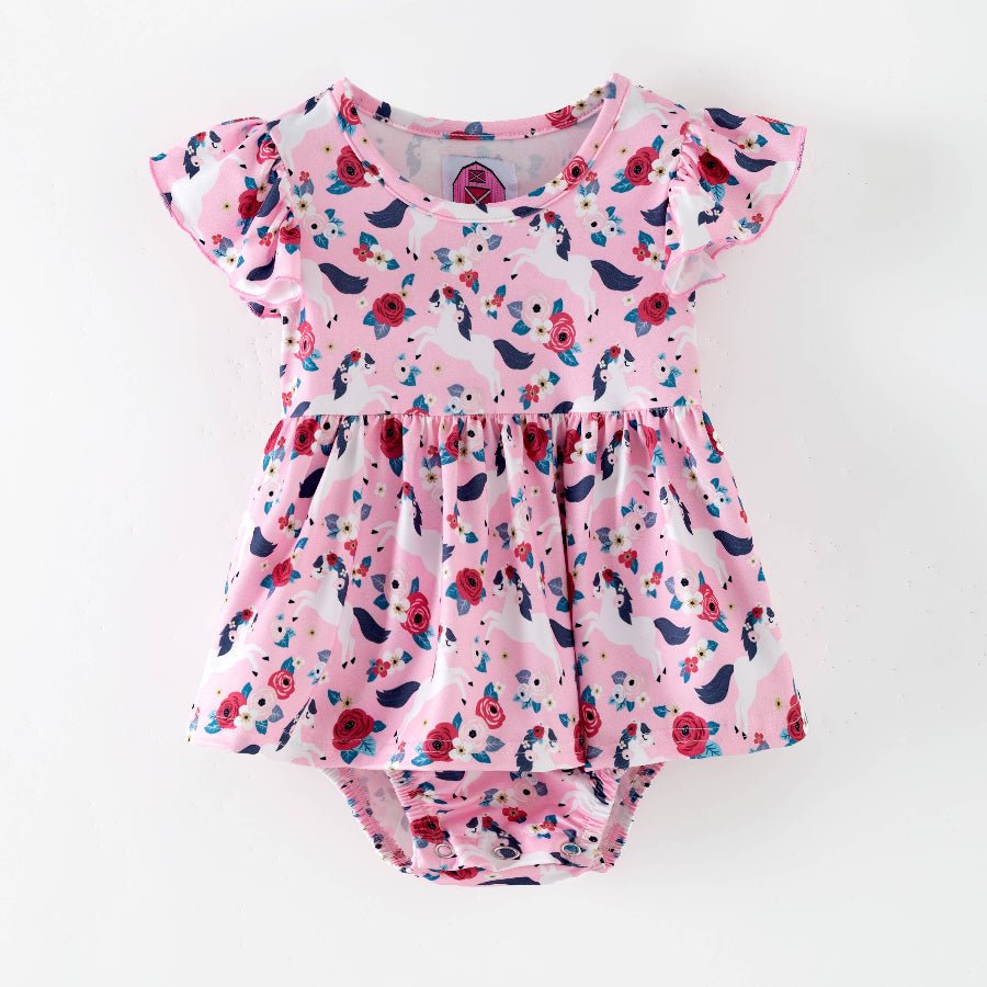 Pink floral baby romper on a white background