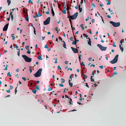 Pink children's romper with floral and pony pattern on a white background