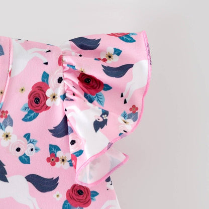 Pink fabric with floral and pony pattern on a gray background