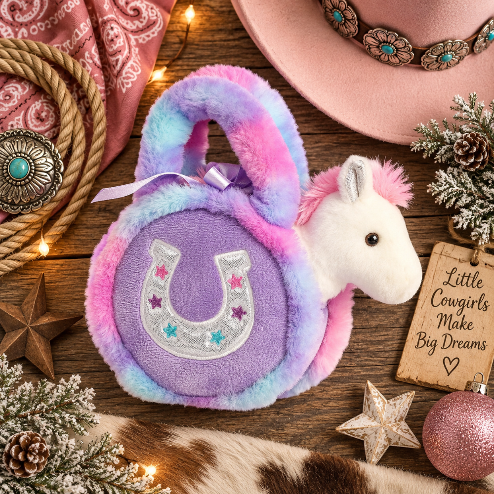 A plush pony-shaped purse with a fuzzy lavender body, pink and blue tie-dye trim, and a white horse head on the side. The front has an embroidered horseshoe design with small star accents.