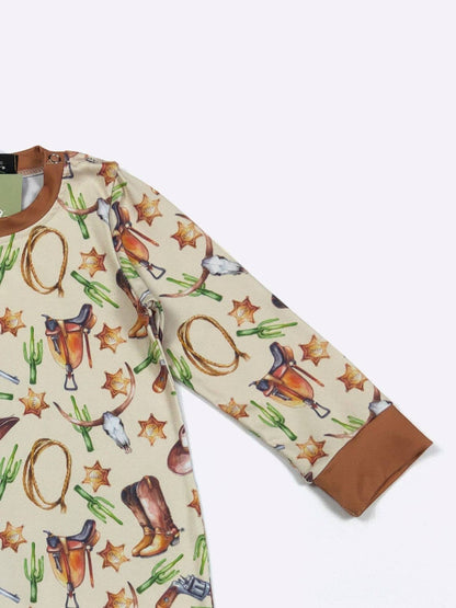 Long-sleeve shirt with western-themed print on a white background
