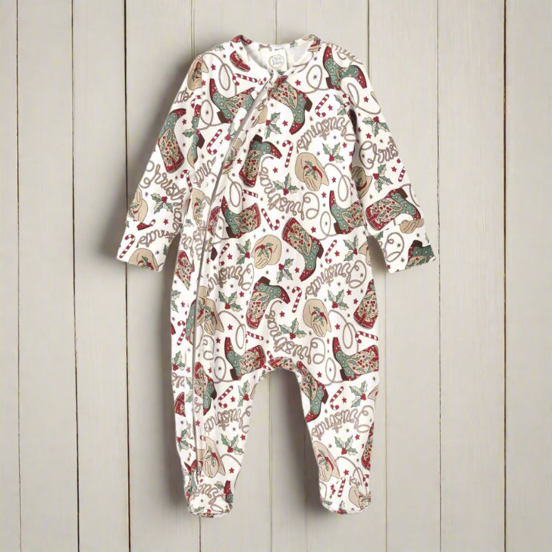 Baby onesie with festive Christmas western pattern on a white background