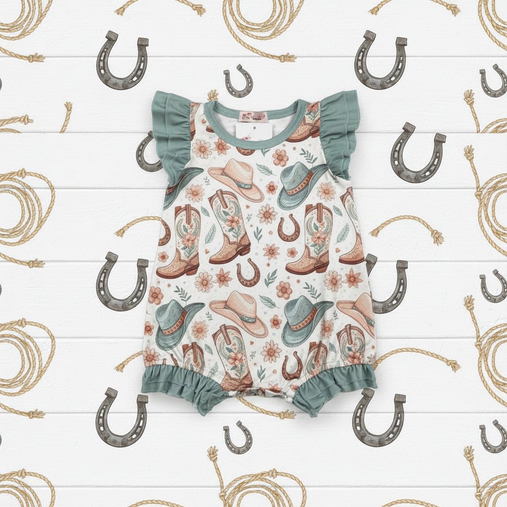 Baby romper with cowboy print on a white background