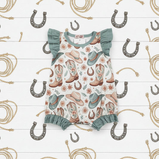 Baby romper with cowboy print on a white background
