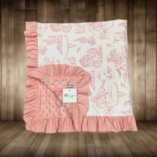 Pink western baby blanket with ruffled edge on a white background