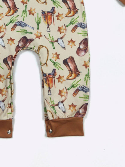 Baby romper with cowboy pattern on a white background