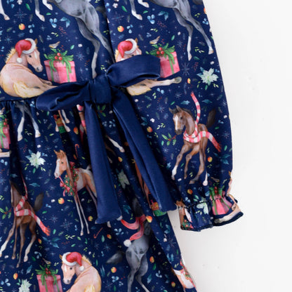 Navy waist bow and gathered sleeve cuff on the Christmas horse print dress.
