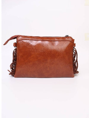 Brown leather clutch bag with fringe details on a white background