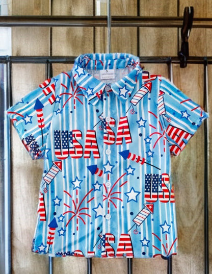Boys’ patriotic shirt with flags hanging on wood