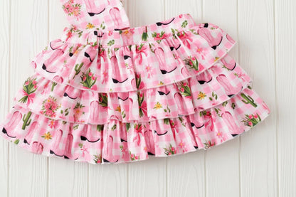 pink cowgirl boot skort on white background