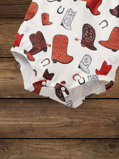 Boot and horseshoe print close-up on baby romper