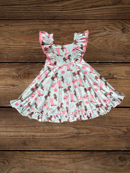 Flat lay of toddler teal western dress with pony print