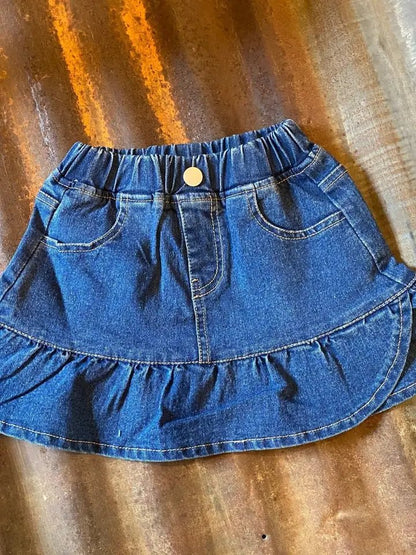 Flat lay of girls denim skirt with ruffle hem design