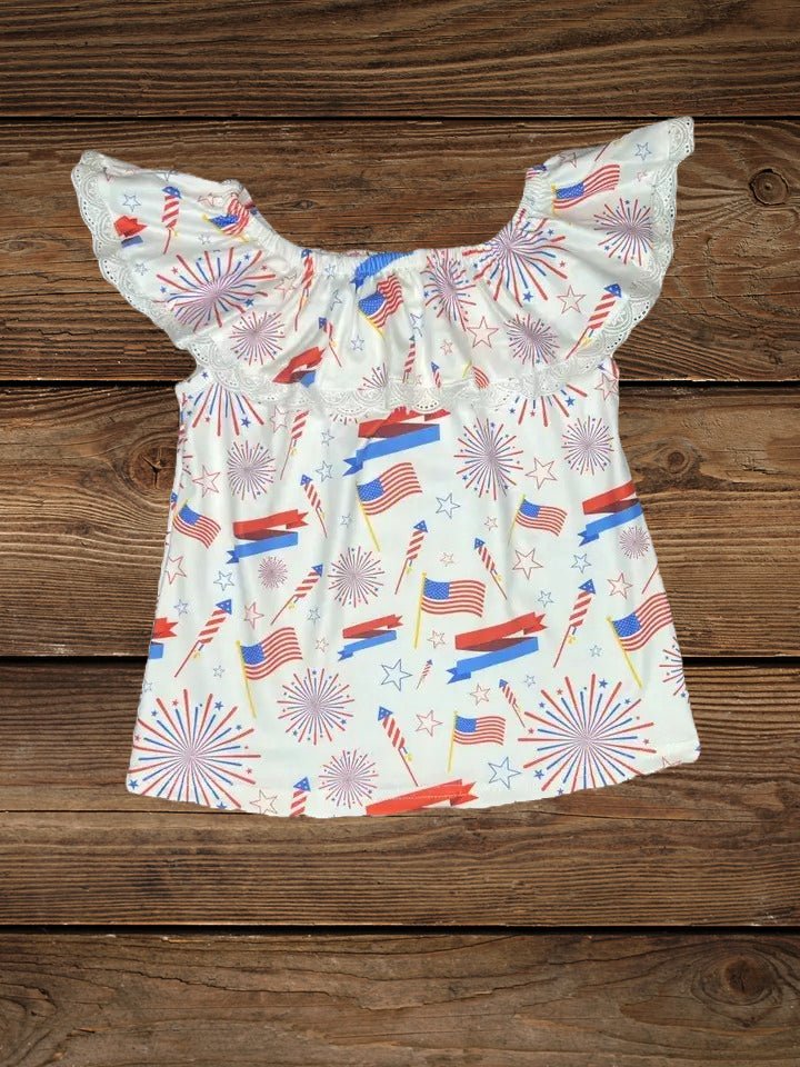 Flat lay of star-spangled lace top with red, white, and blue print