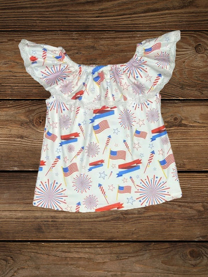Flat lay of star-spangled lace top with red, white, and blue print