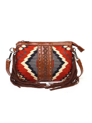Crossbody bag with tribal pattern and brown leather accents on a white background