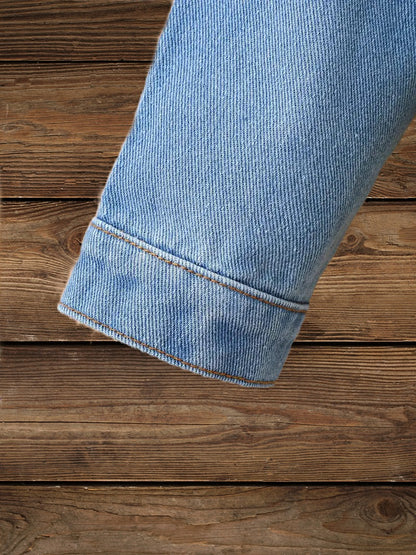 Denim sleeve detail on Glitter & Glamour Girls' Sequin Tassel Denim Jacket highlighting durable stitching.