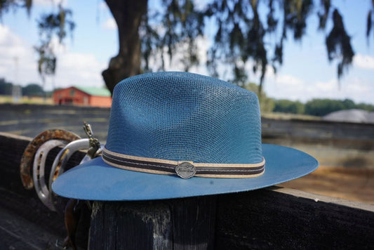 Indigo paint a cowboy hat for kids on a ranch fence, stylish Western kids' cowboy hat