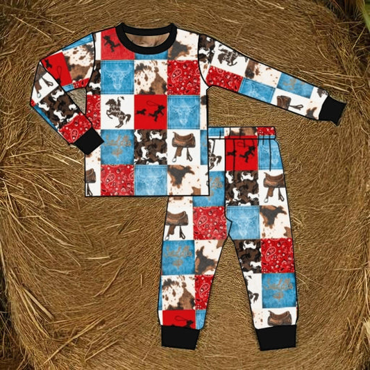 Little Bronco Dreamer Western Horse Pajama Set for boys featuring colorful cowboy-themed print, soft and cozy kids pajama set on hay background