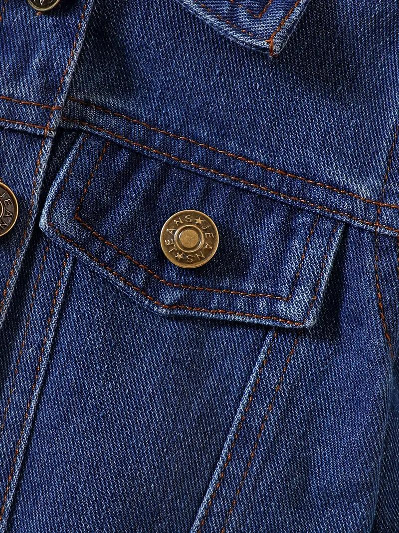 Detailed view of pocket stitching and metal button on Little Wrangler denim jacket