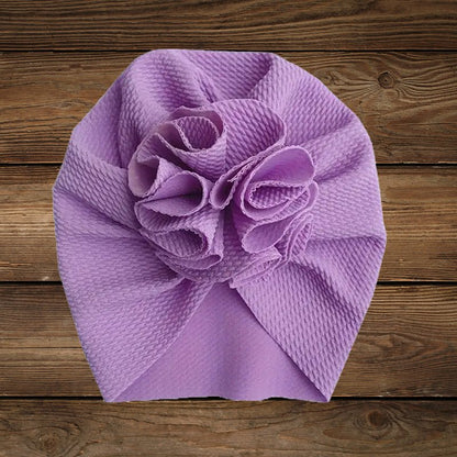 Purple turban hat with flower design for baby girls