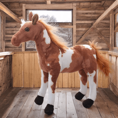 Realistic light brown and white horse plush toy with fluffy mane