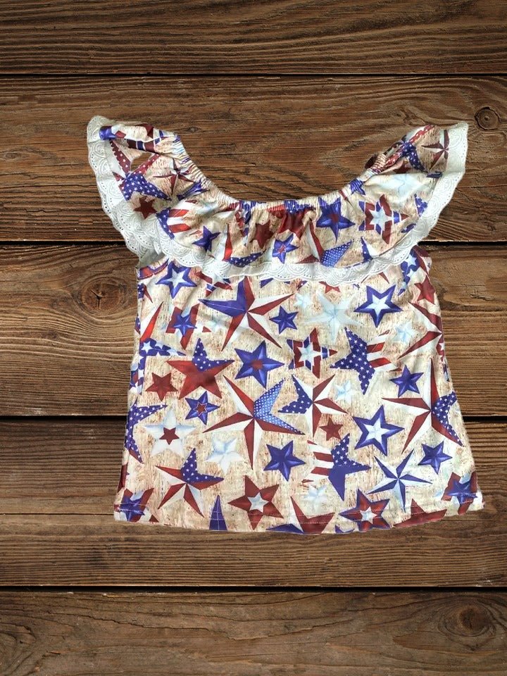 Flat lay of girls patriotic star lace top with red, white, and blue print