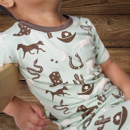 Top and bottom toddler western pajamas with hat detail