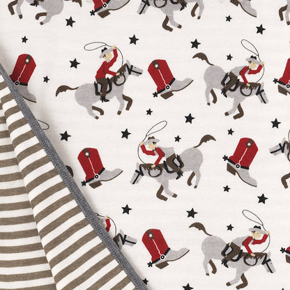 Red and black cowboy print detail on bamboo romper