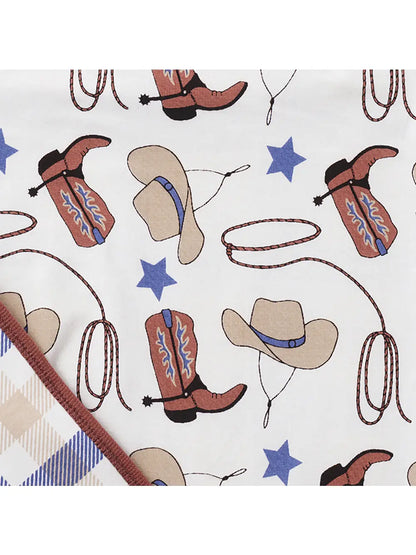 Flatlay showing cowboy boot and hat print on bamboo romper