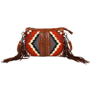 Handbag with tribal pattern and fringes on a white background