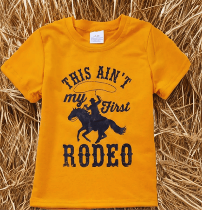 Kids yellow cowboy t-shirt with "This Ain’t My First Rodeo" design and horse graphic