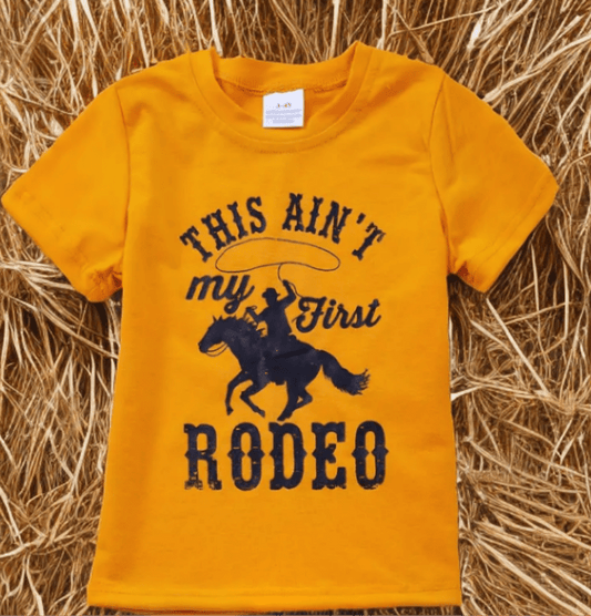 Kids yellow cowboy t-shirt with "This Ain’t My First Rodeo" design and horse graphic